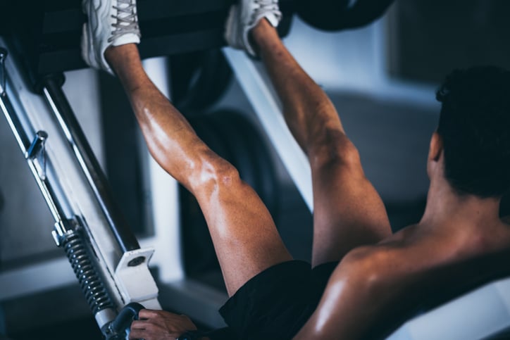 man does leg press
